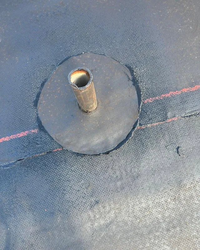 Vent pipe flashing sealed into a new flat roof membrane