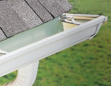 Gutter services in New Jersey – ALL PRO Roofing installation team working on residential home